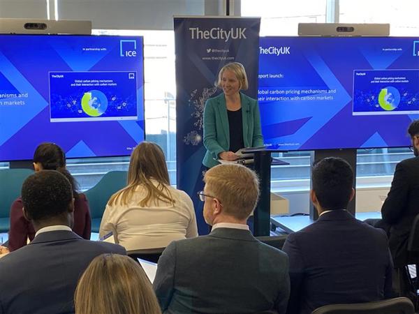 A phot of Emma Reynolds speaking from a lectern at the launch of TheCityUK's ‘Global carbon pricing mechanisms and their interaction with carbon markets’ report